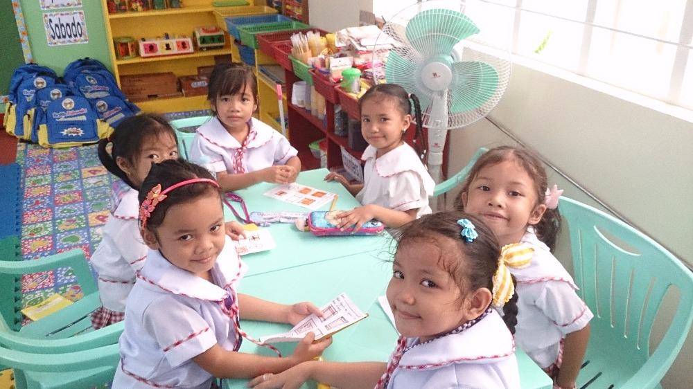 Pupils using learning materials