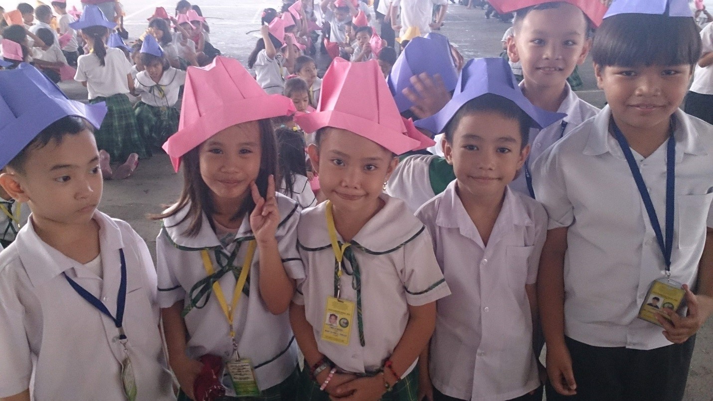 Students in paper hats