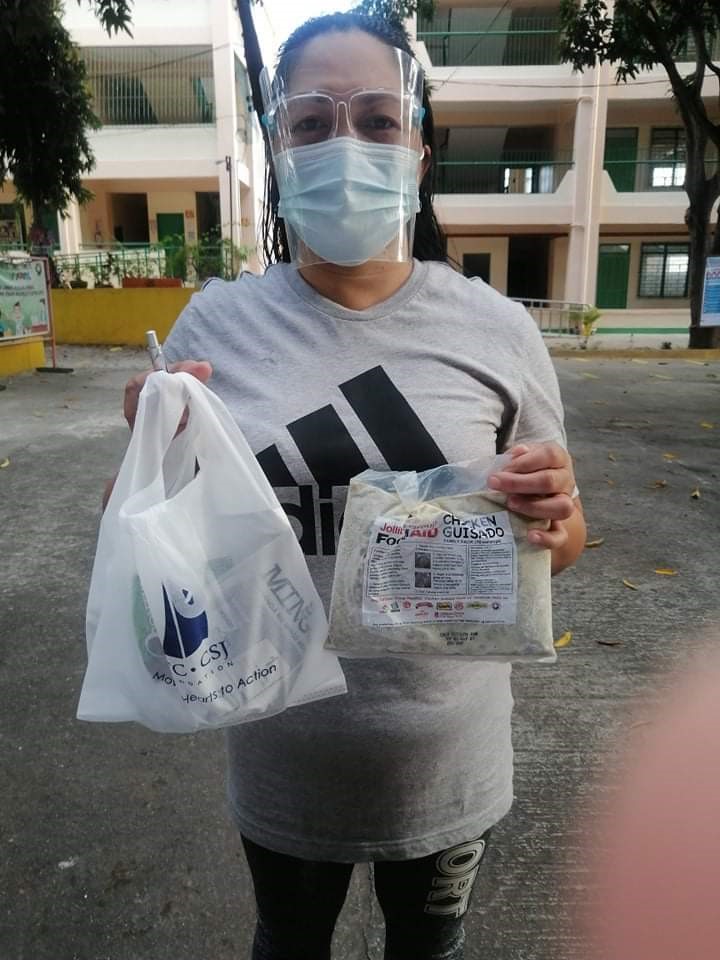 A mother receiving the donation